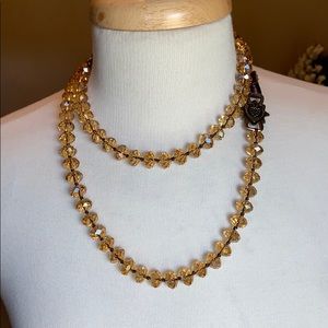 Love Heals HM  Gold beaded necklace w/leather tie